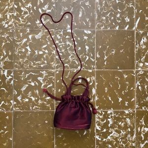Vintage metallic burgundy drawstring mini bag